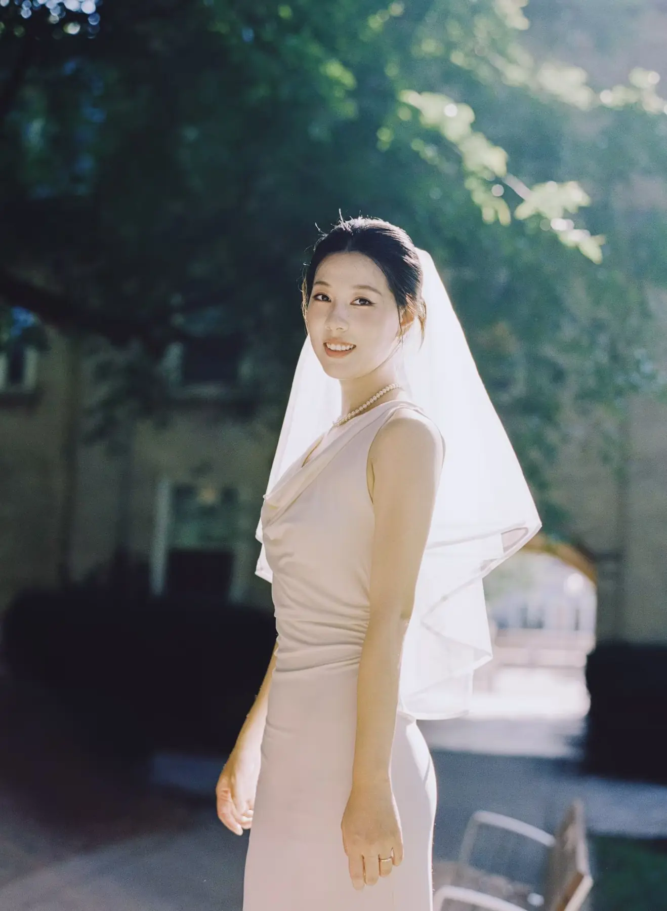 Bride outdoors in softly lit styling by Angelina