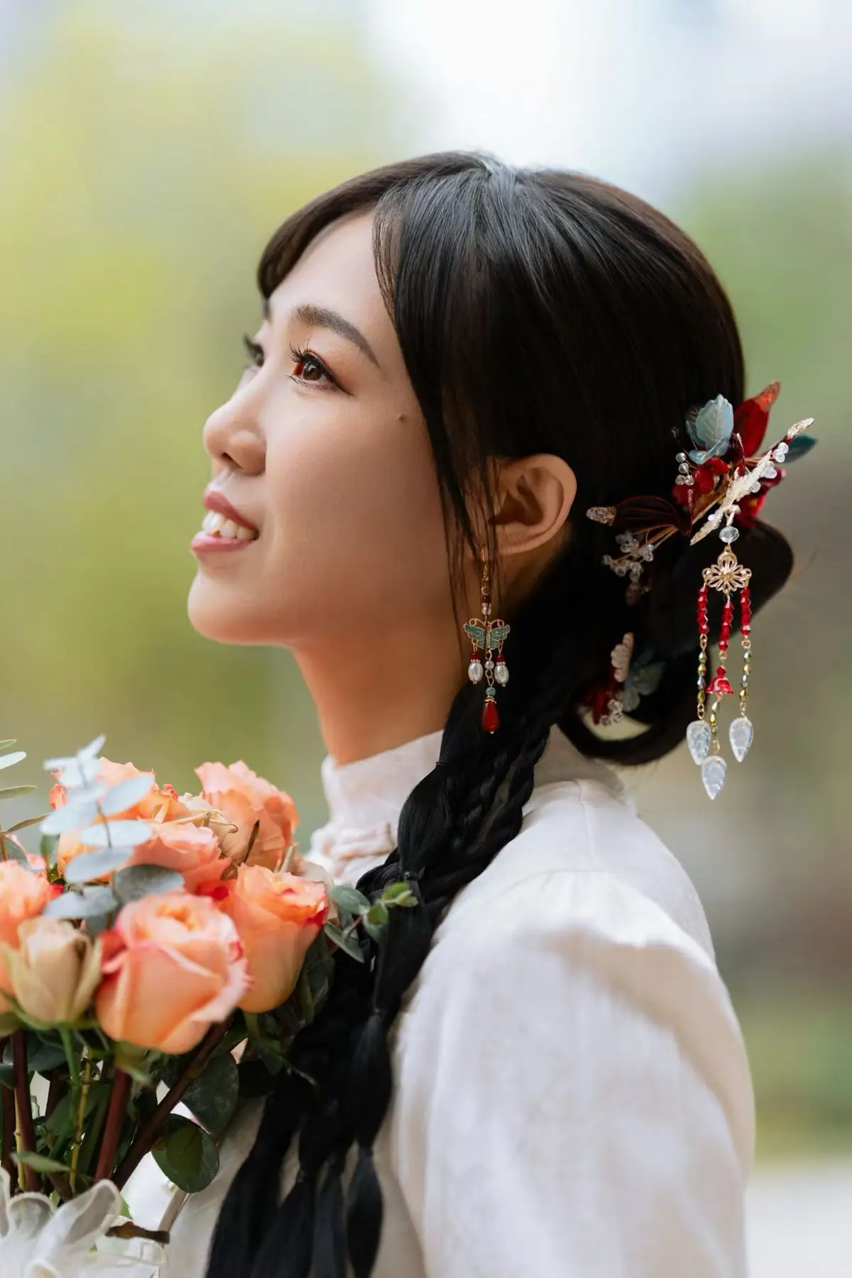 Bridal profile with floral hair ornaments by Elaine