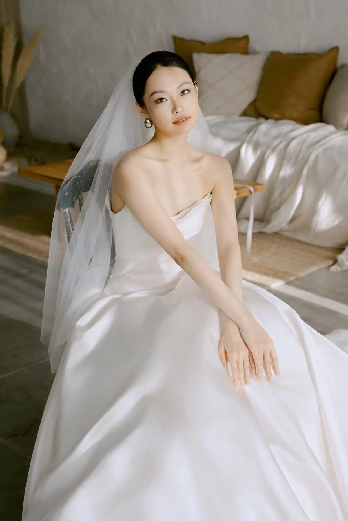Bride seated in soft window light