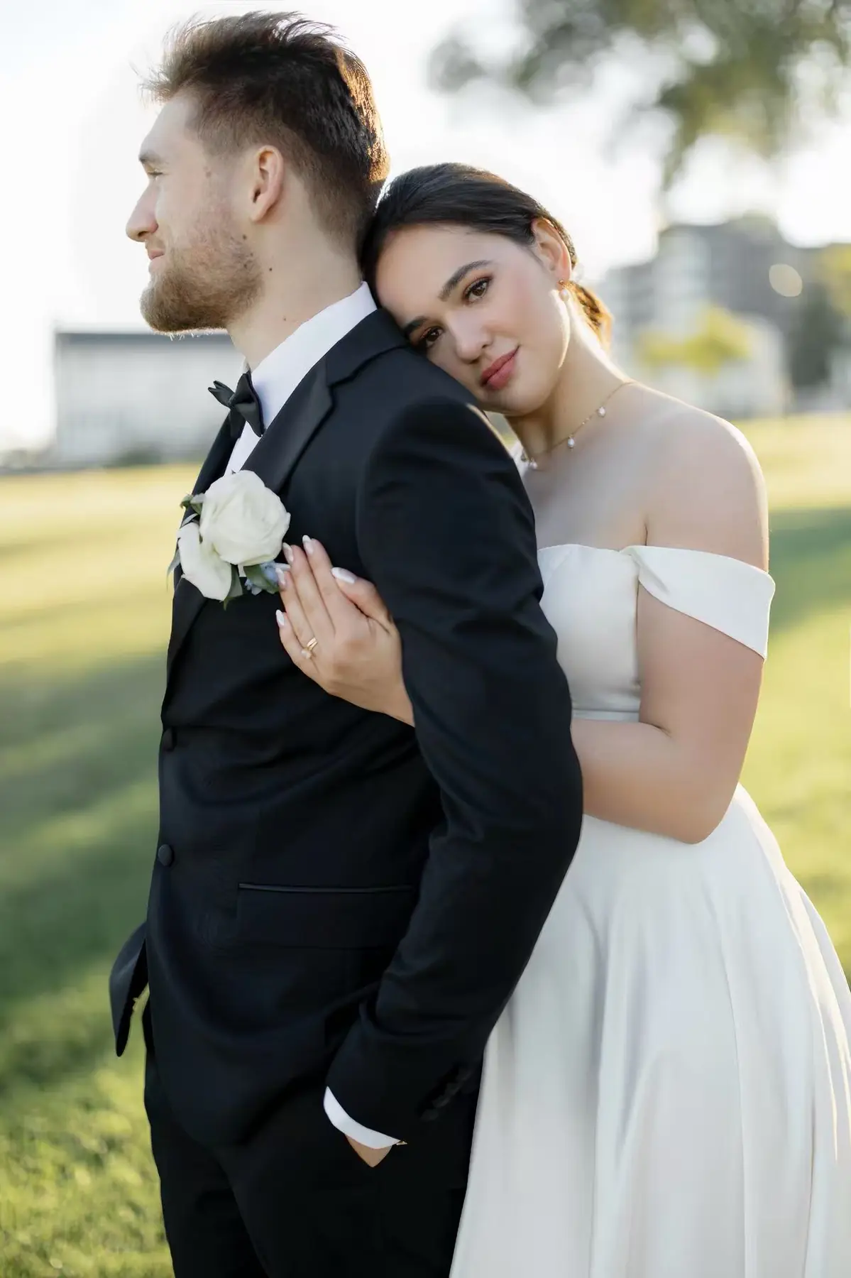 Bride and groom in a softly lit outdoor portrait