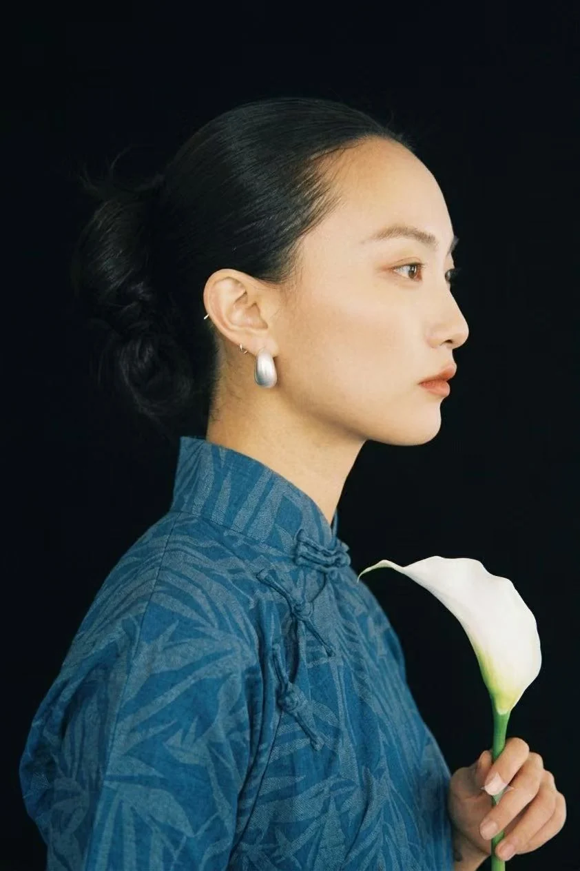 Sleek bridal beauty profile with a white calla lily