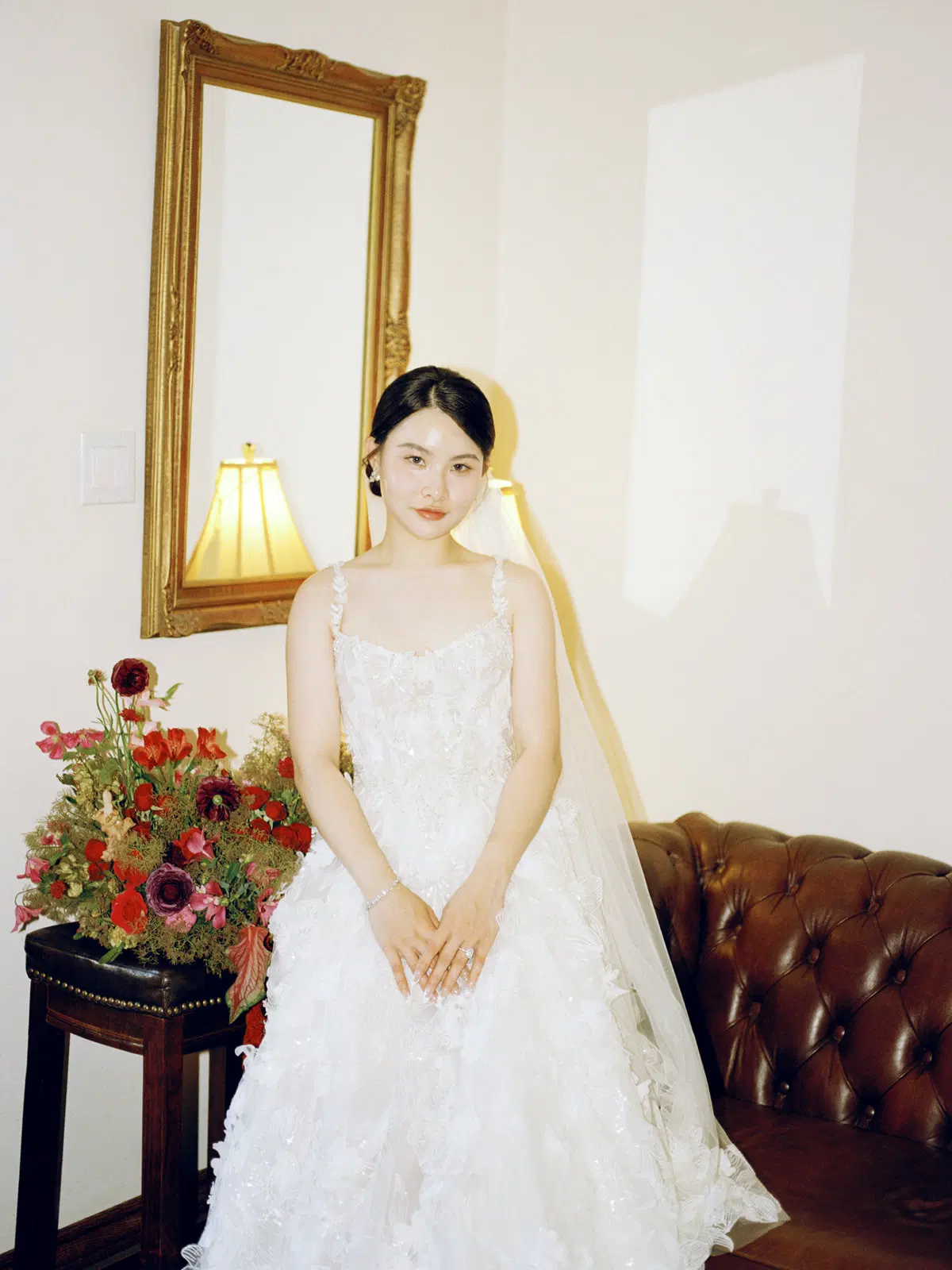 Seated bride in a warm interior