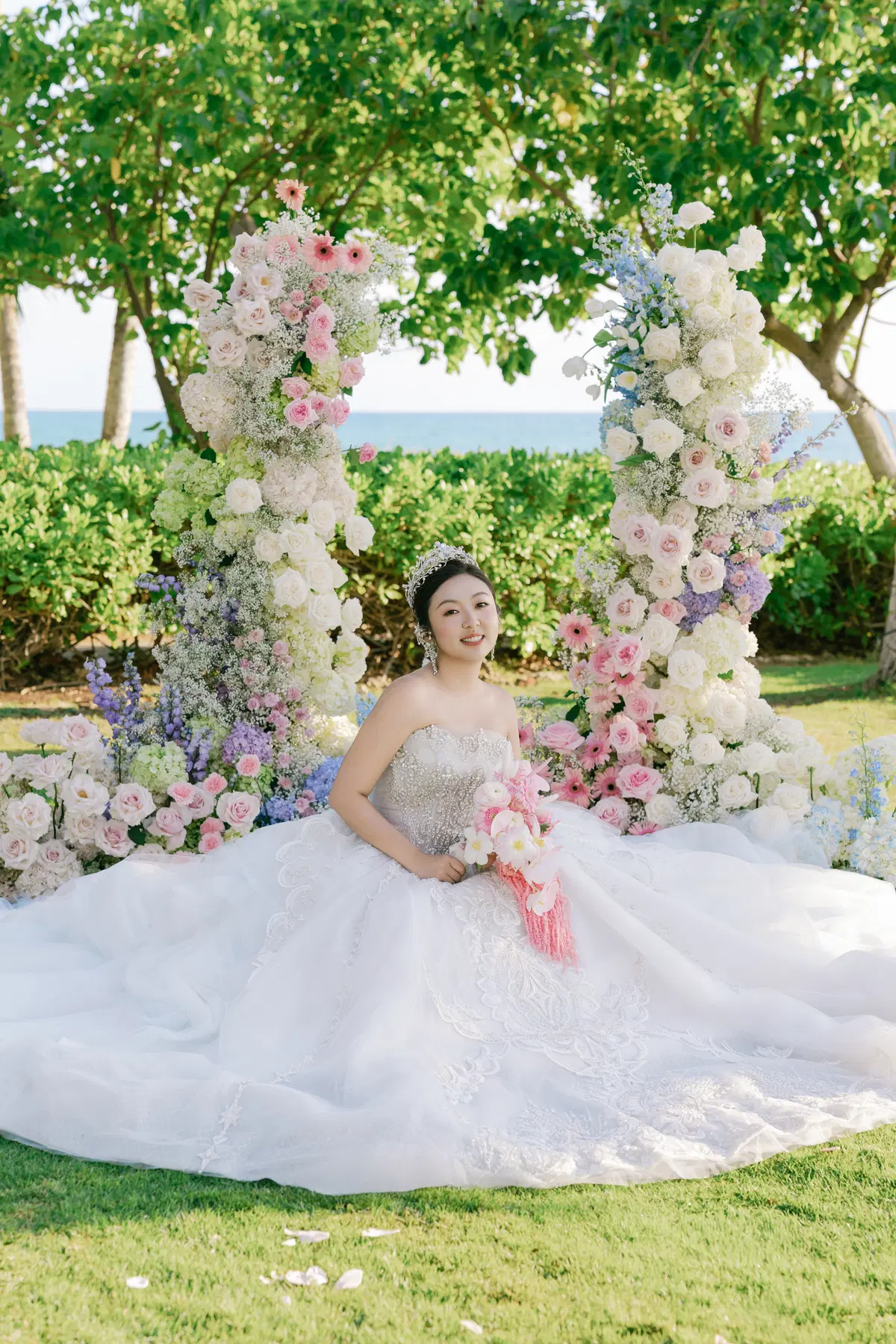 Bride seated beneath garden florals
