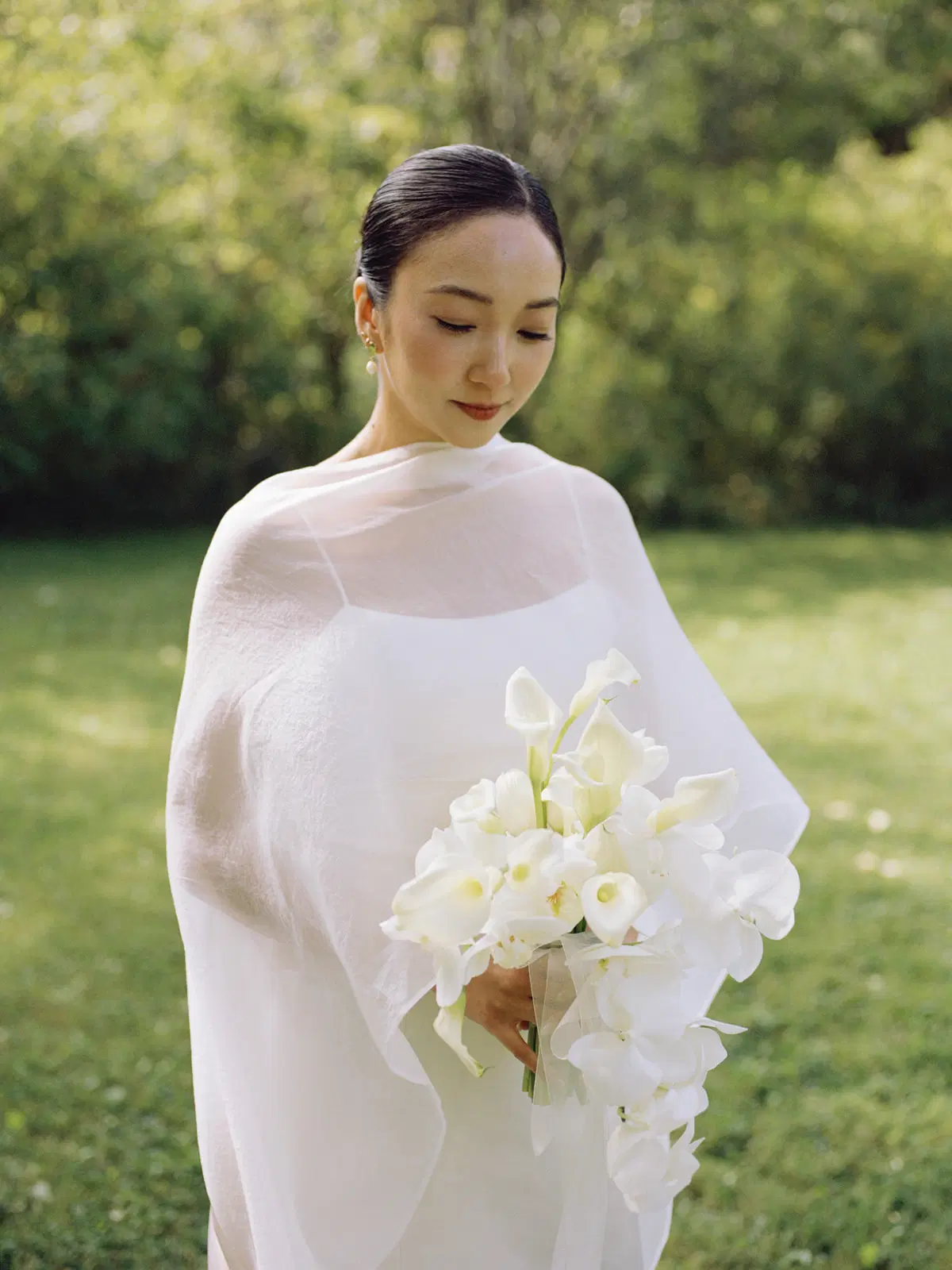 Minimalist outdoor bridal portrait with orchids