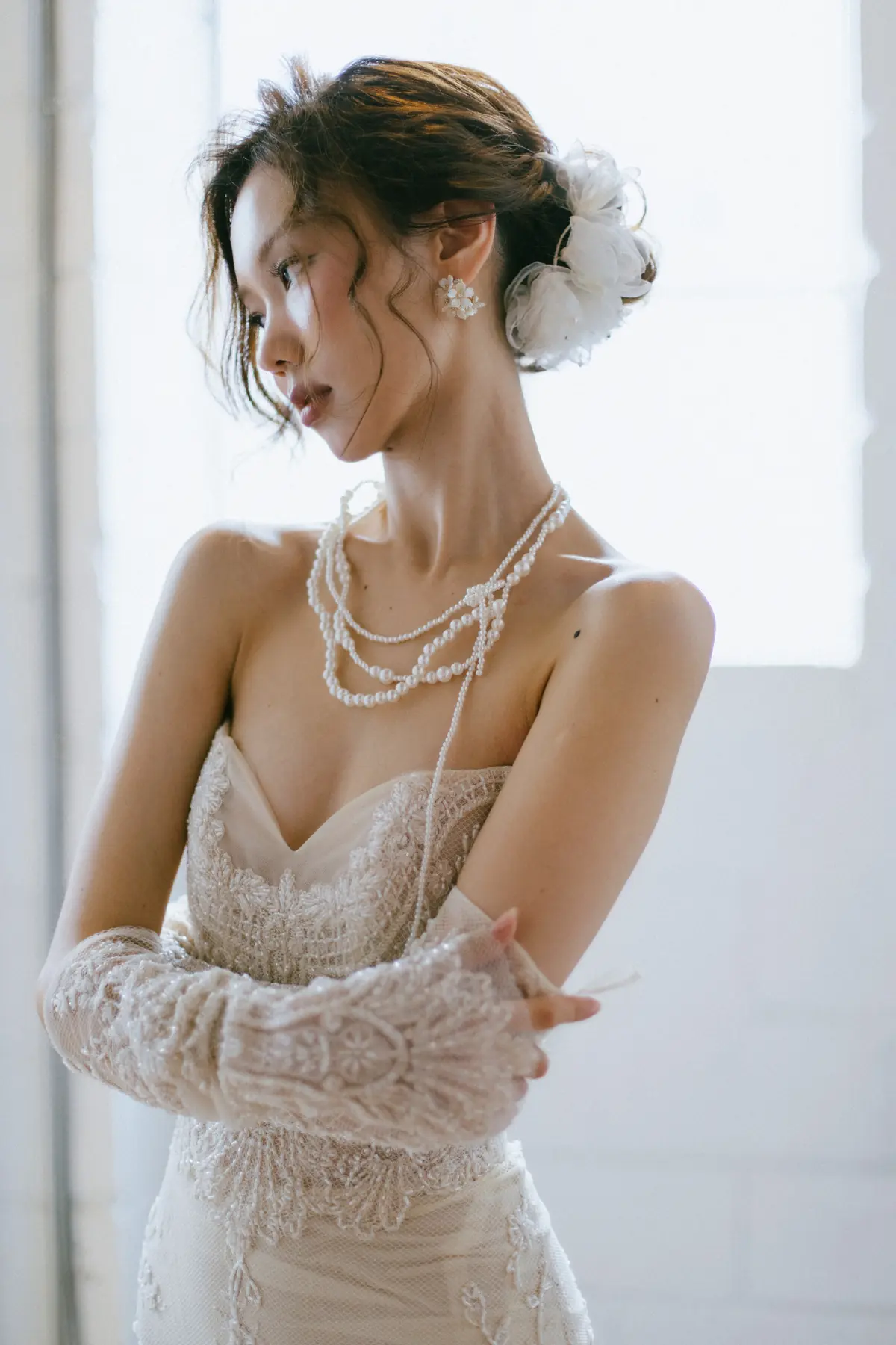 Soft bridal hair and pearl detail by Yuki