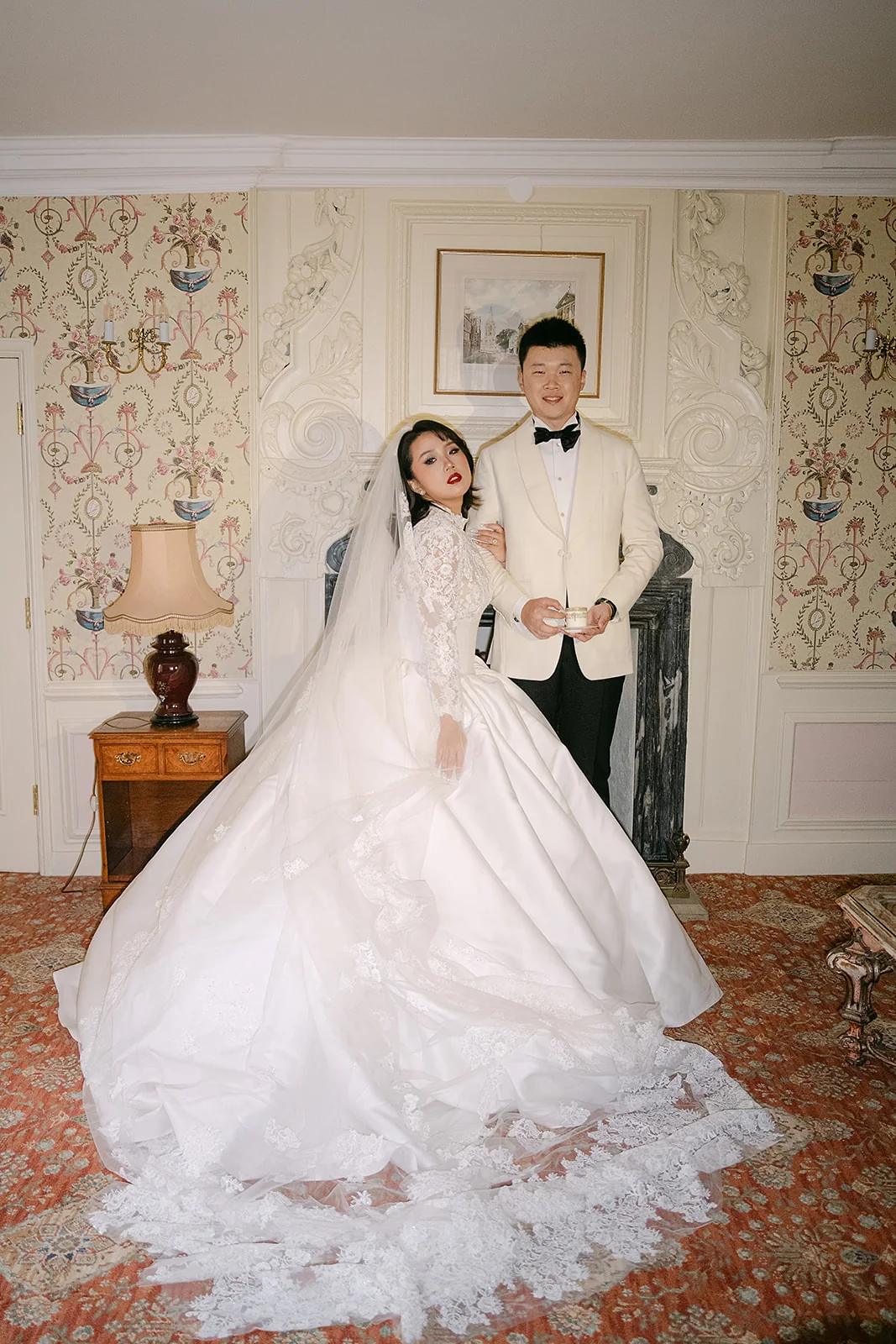 Newlyweds posing in an elegant interior