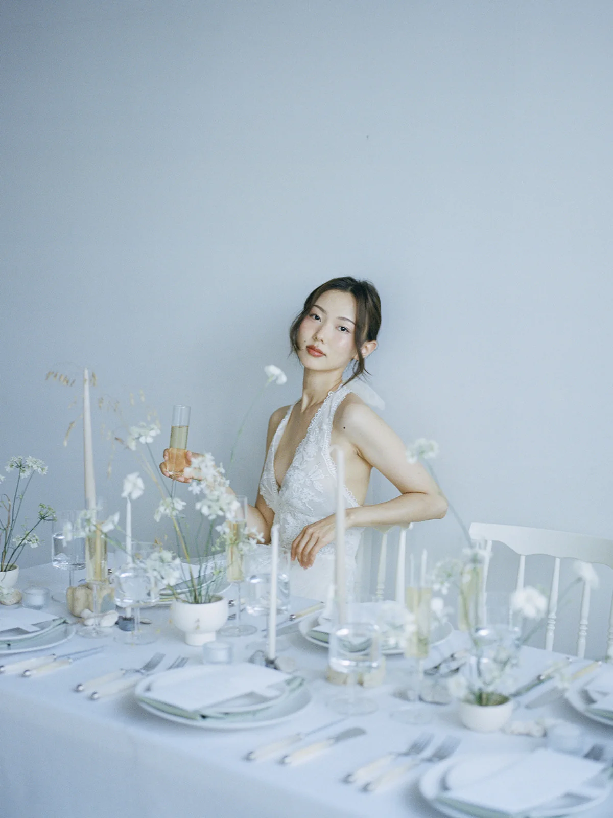 Bride beside a delicate reception table