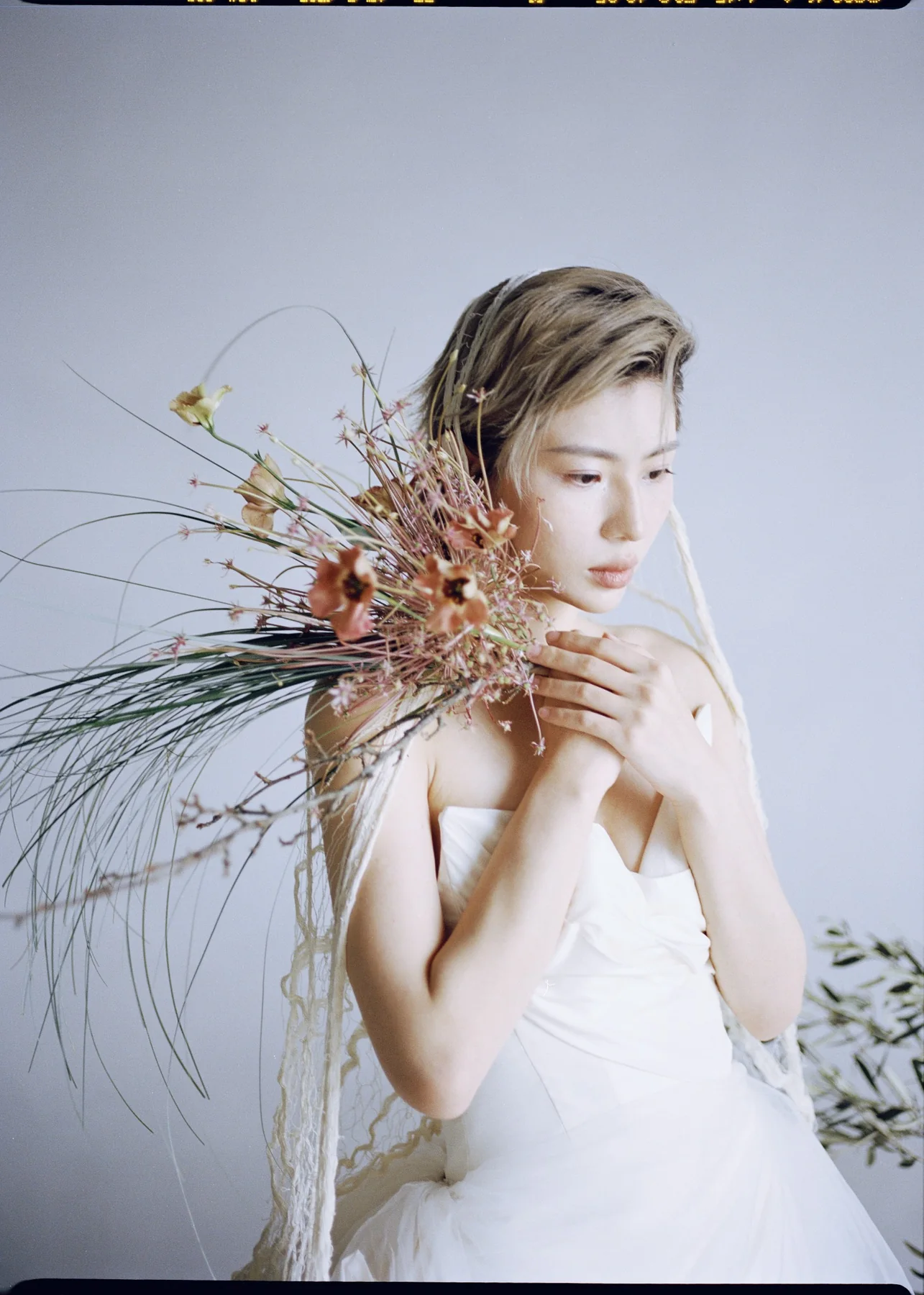 Bridal editorial with a sculptural dried bouquet