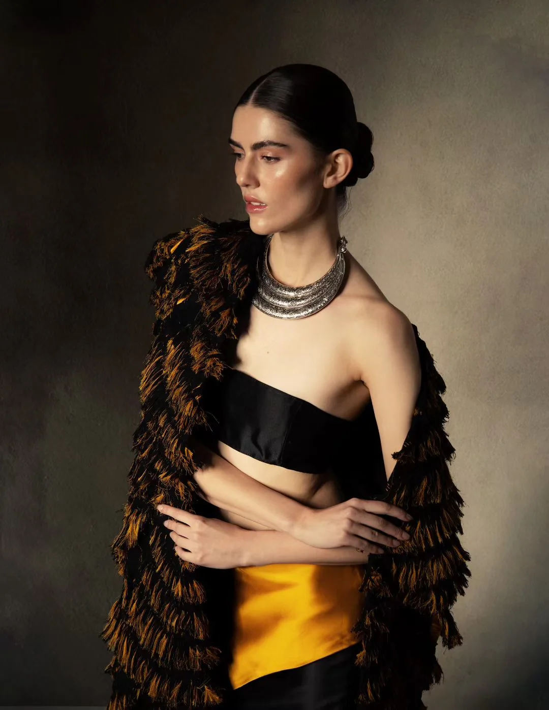 Editorial fashion styling in black and gold