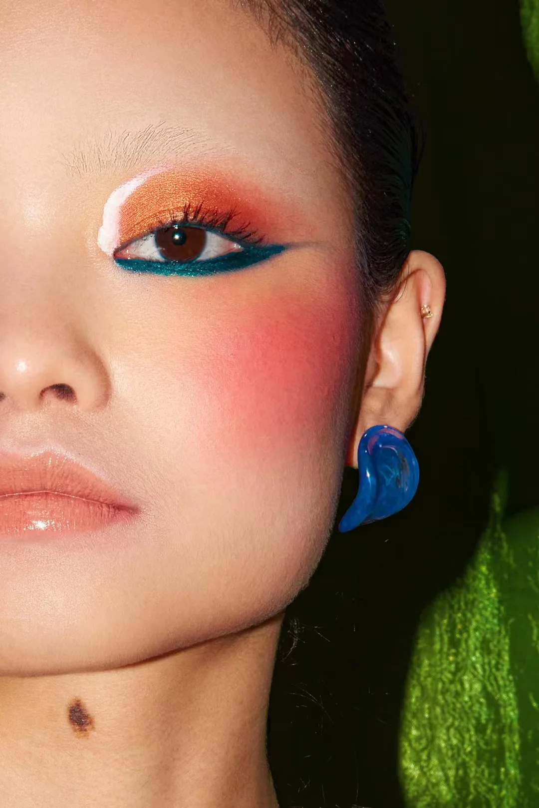 Graphic editorial eye makeup in vivid colour