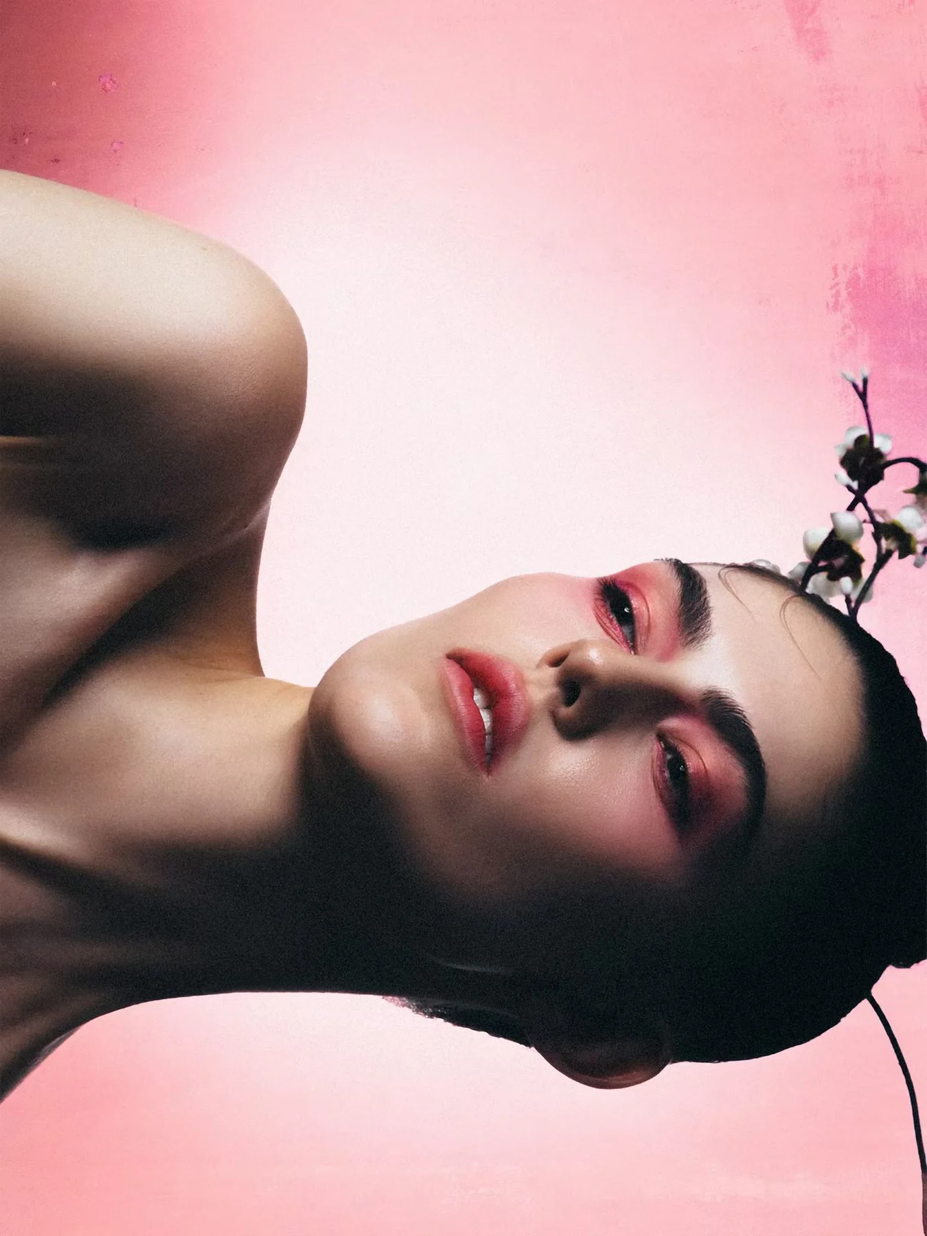 Beauty portrait in dramatic pink light